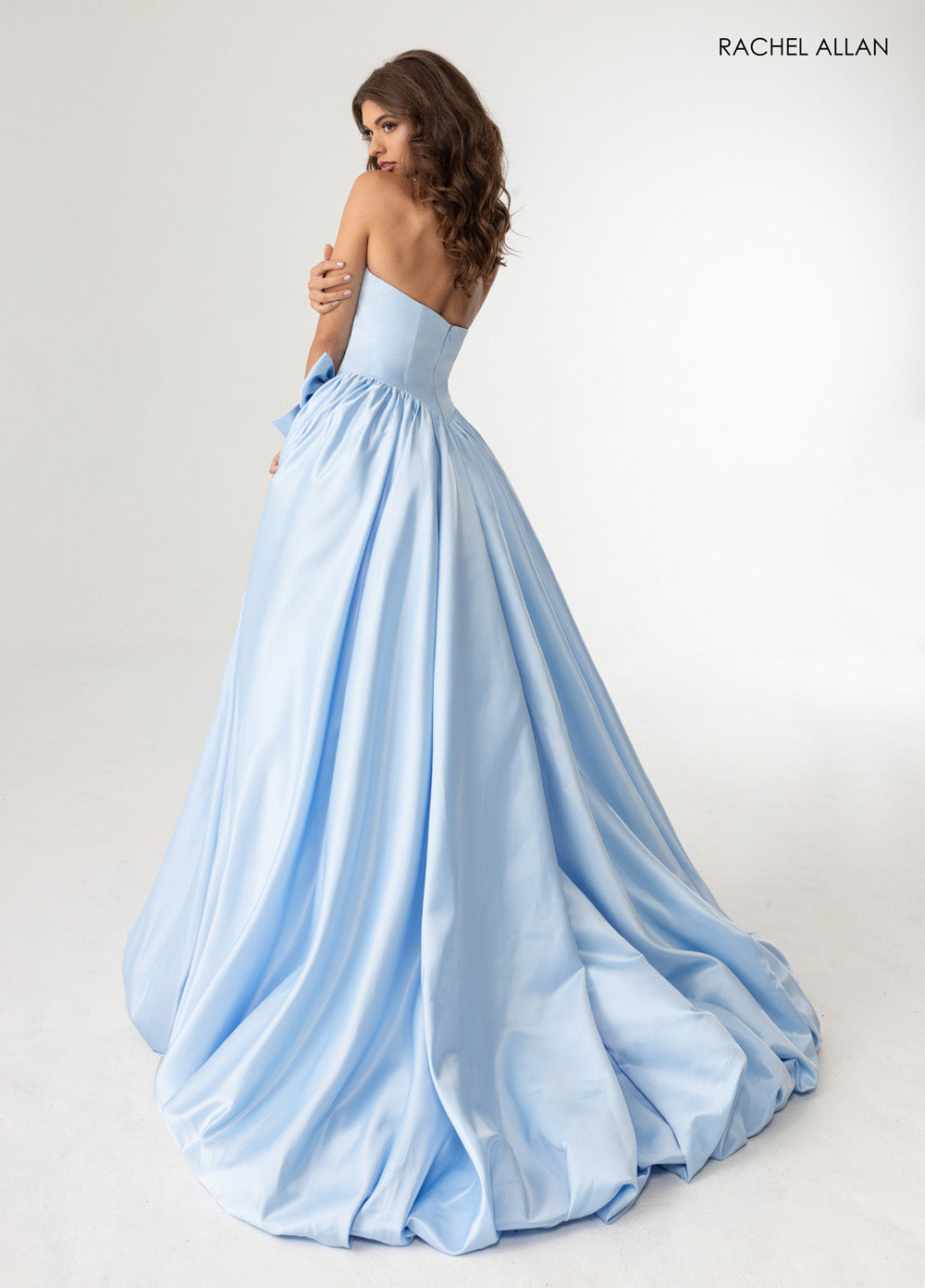 Rachel Allan 71035 Powder blue ballgown with a flowing skirt and a stunning lace-up back prom dress.