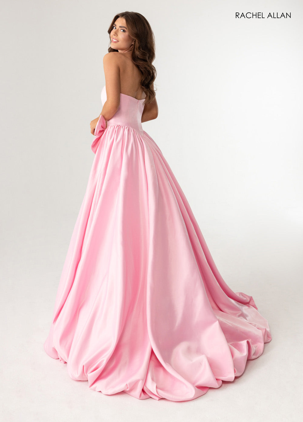 Rachel Allan 71035 Pink ballgown with a flowing skirt and a strapless design, perfect for prom prom dress.