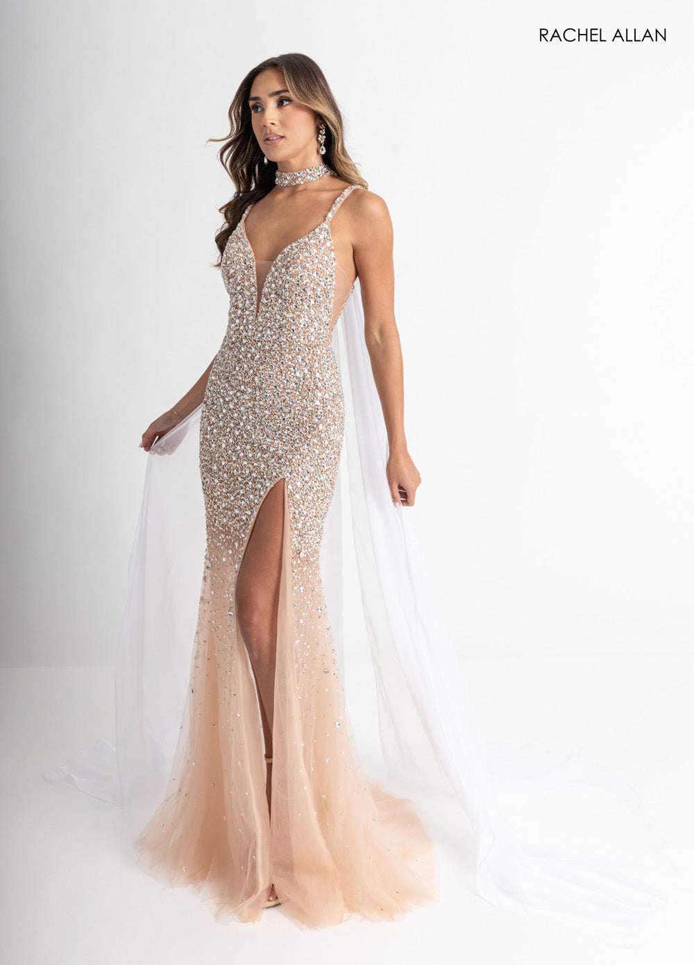 Rachel Allan 71047 Nude pink mermaid prom dress with crystal beading and a thigh-high slit.