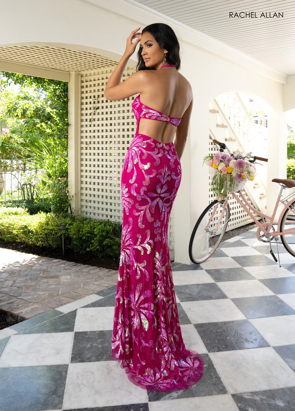 Rachel Allan 71048 Fuchsia pink mermaid prom dress with intricate beading, back view.