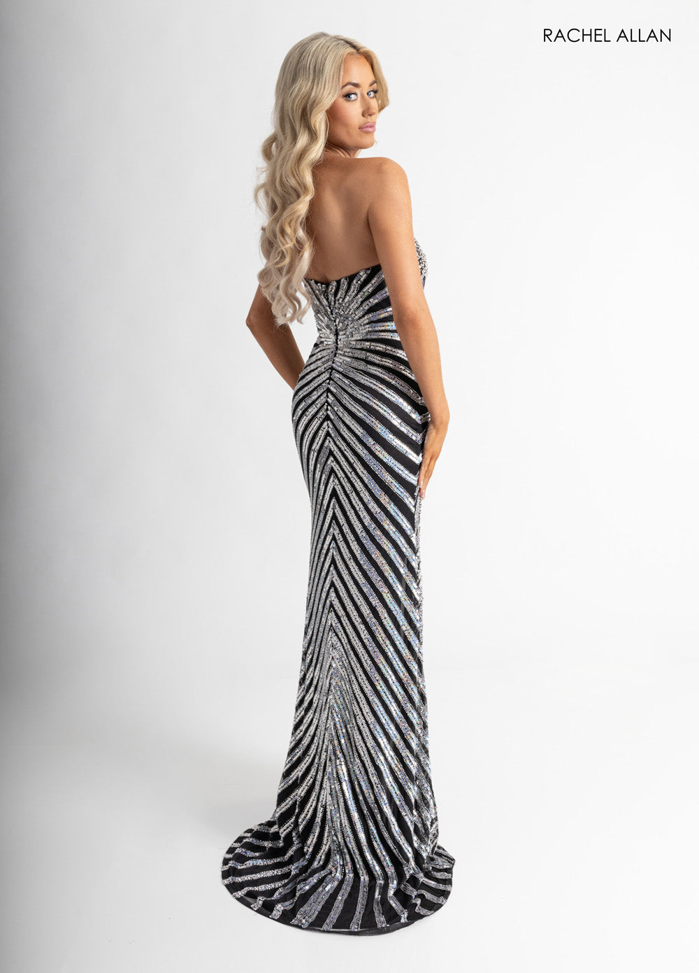 Rachel Allan 71054 Black silver mermaid prom dress with stunning beading, back view.