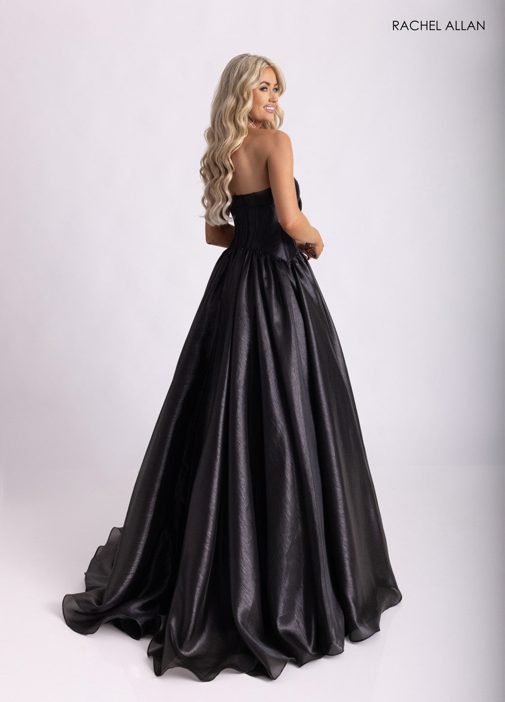 Rachel Allan 71060 Black ballgown with a corset back, perfect for prom or formal occasions prom dress.