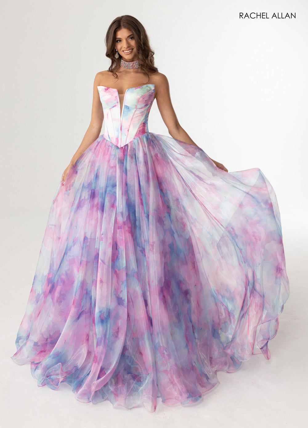 Rachel Allan 71069 Pink multi A-line prom dress with a corset bodice and flowing organza skirt.