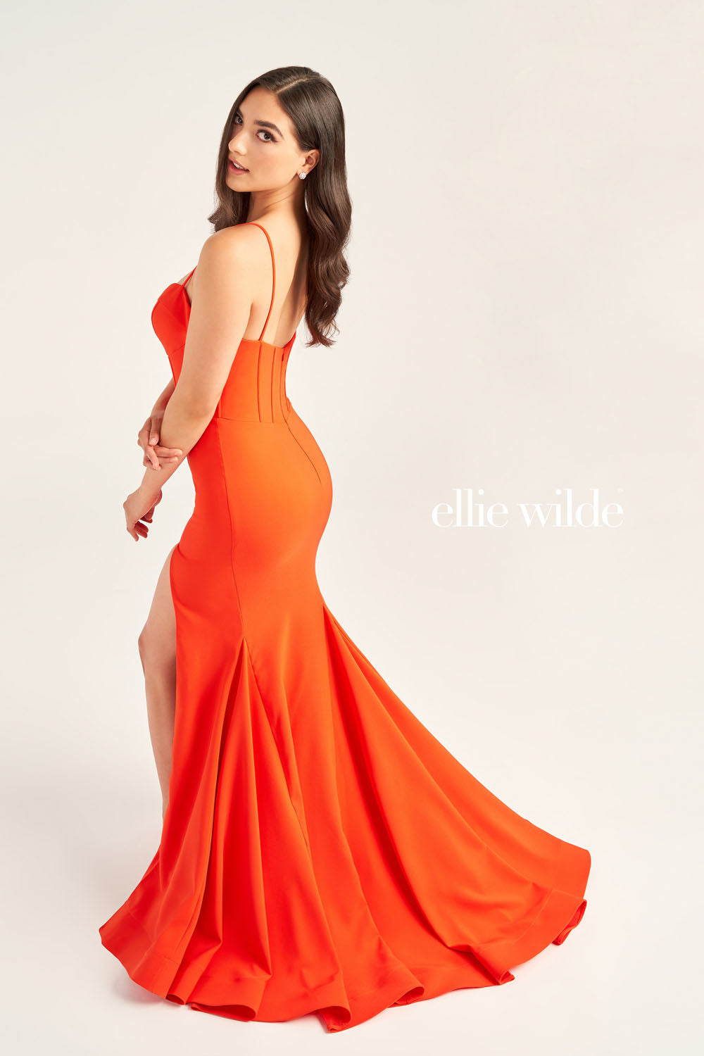 Ellie Wilde EW35214 prom dress images. Ellie Wilde EW35214 is available in these colors: Orange, Red, Navy Blue, Black.
