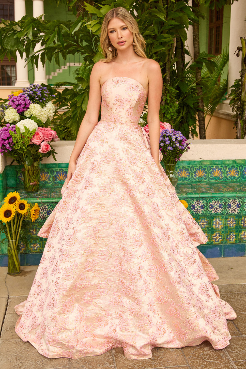 Ava Presley 26412 Blush ballgown prom dress with intricate floral detailing and strapless neckline.