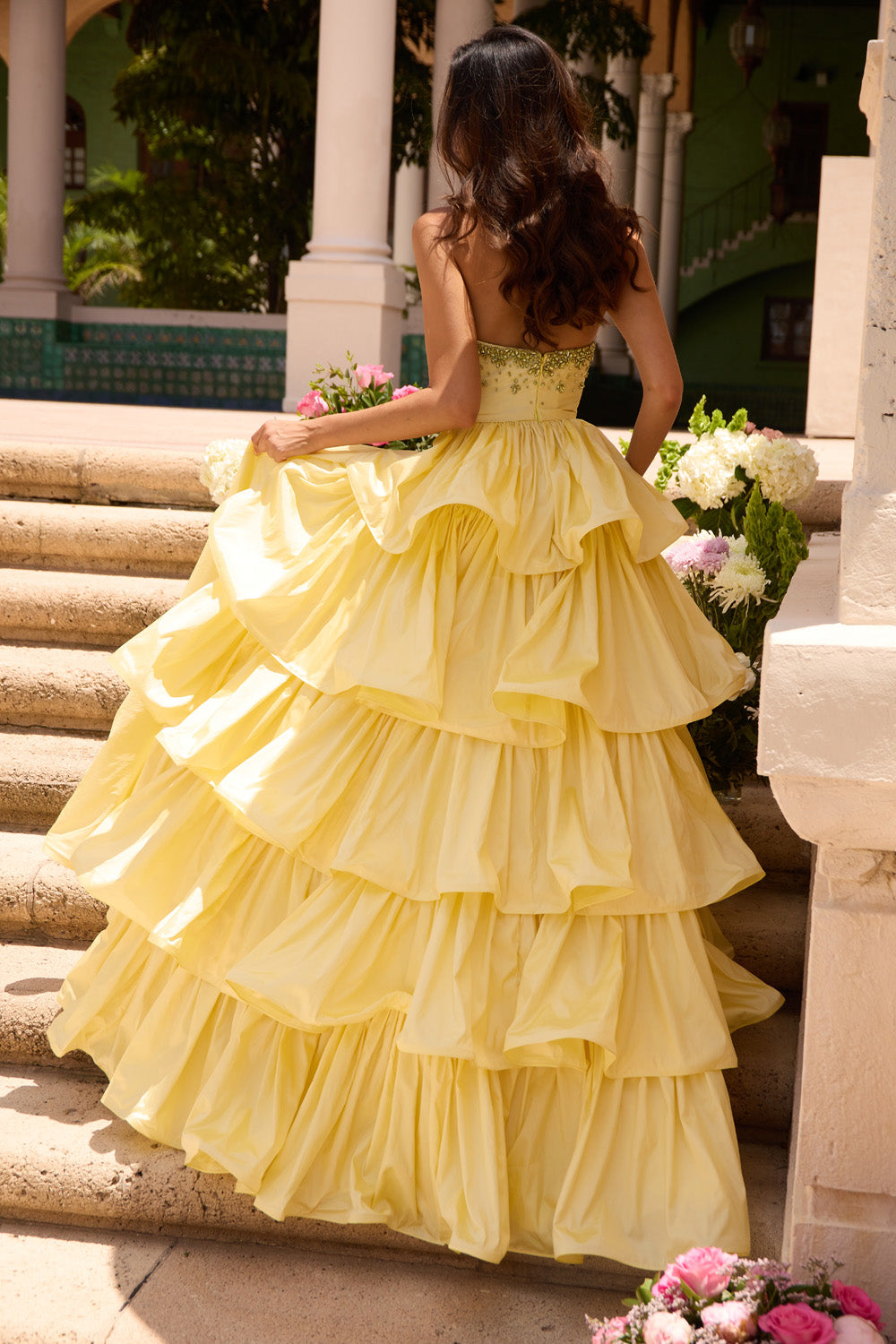 Ava Presley 26417 Soft yellow ballgown with tiered ruffles and a beaded corset back, back view prom dress.