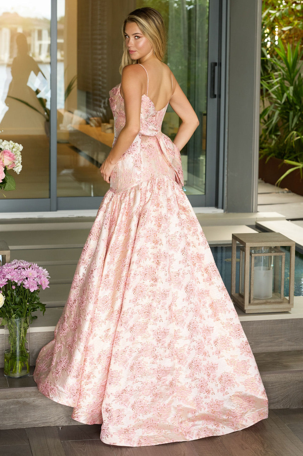 Ava Presley 26419 Blush ballgown prom dress with a lace-up back, featuring a flowing skirt.