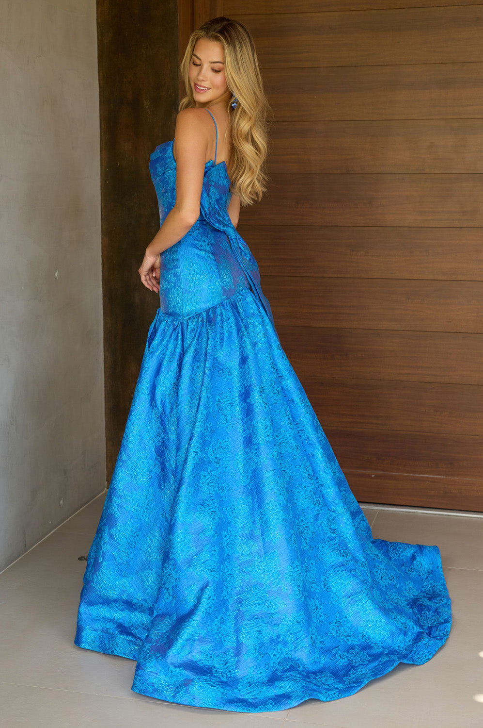 Ava Presley 26419 Royal blue mermaid prom dress with a lace-up back and elegant train.