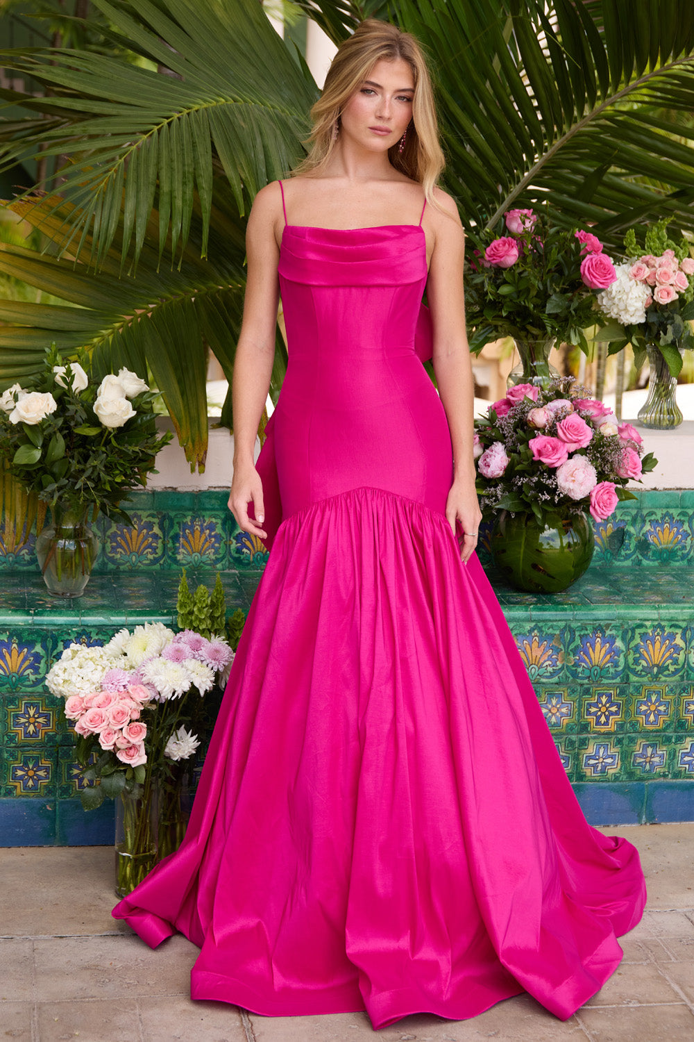 Ava Presley 26422 Magenta mermaid prom dress with a dramatic ruffled train and square neckline.