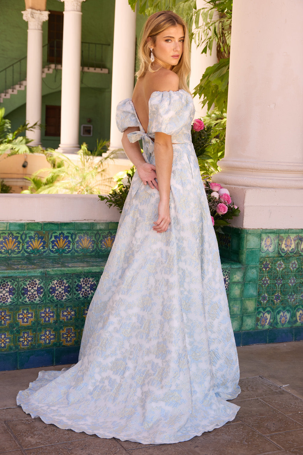 Ava Presley 42267 Light blue A-line prom dress with puff sleeves and a lace-up back, back view.
