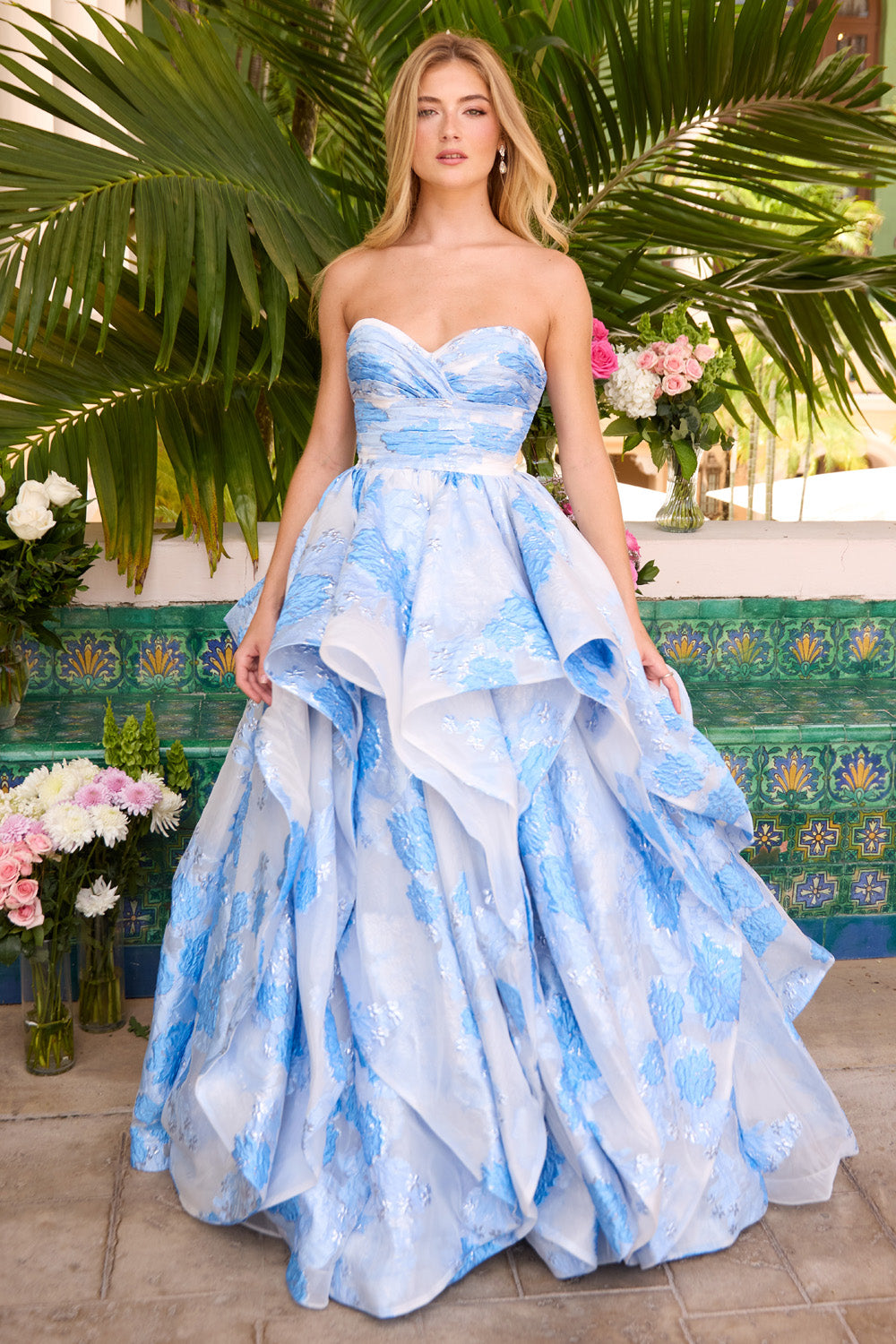 Ava Presley 42293 Light blue strapless ballgown with layered skirt and floral detailing, front view prom dress.