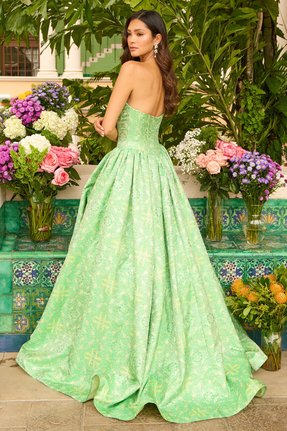Ava Presley 42318 Green ballgown prom dress with a corset back and elegant floral pattern.