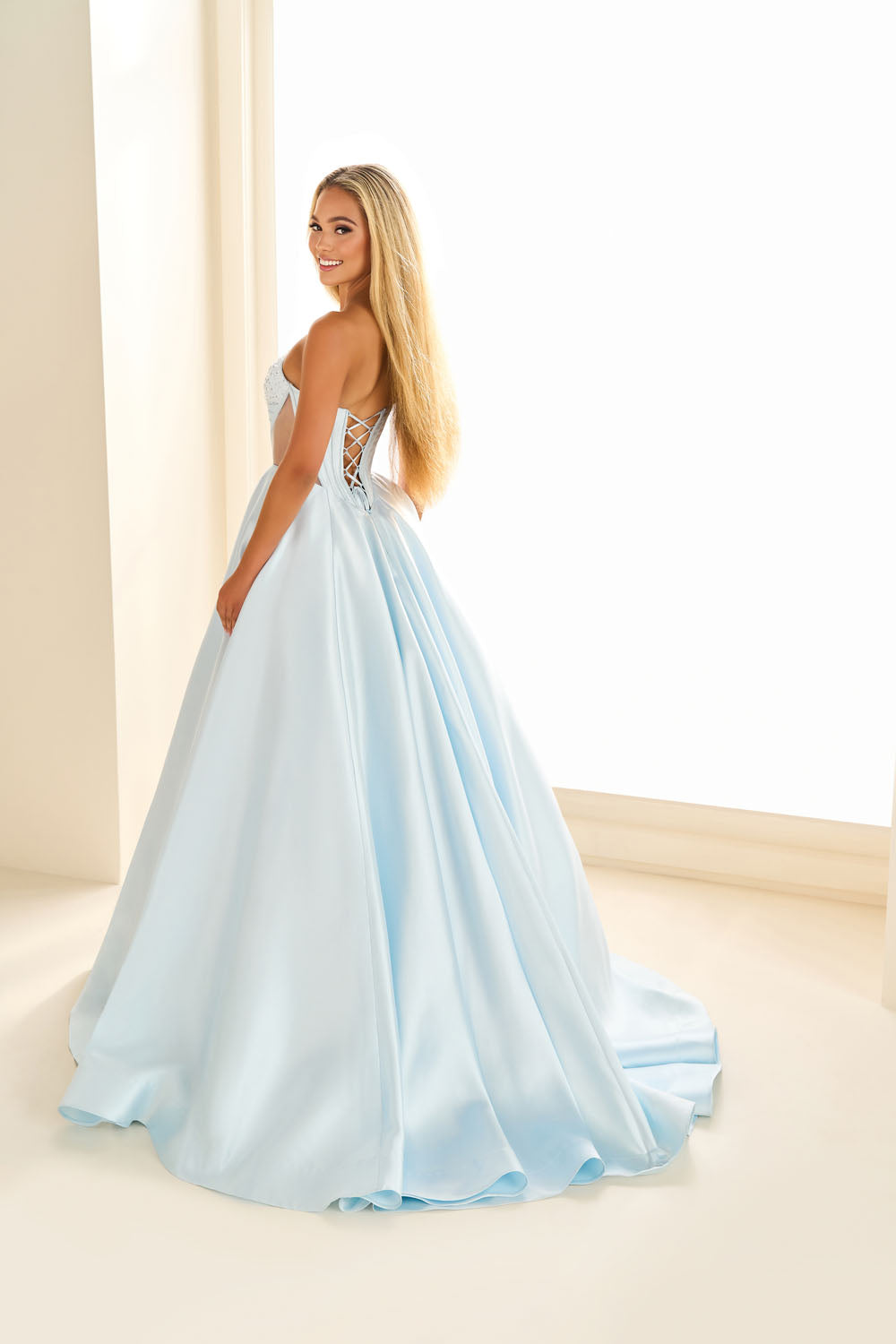 Ellie Wilde EW36025 ball gown prom dress images.  Ellie Wilde EW36025 is available in these colors: Ice Blue, Blue Hydrangea, Red, Emerald, Black, Diamond White.