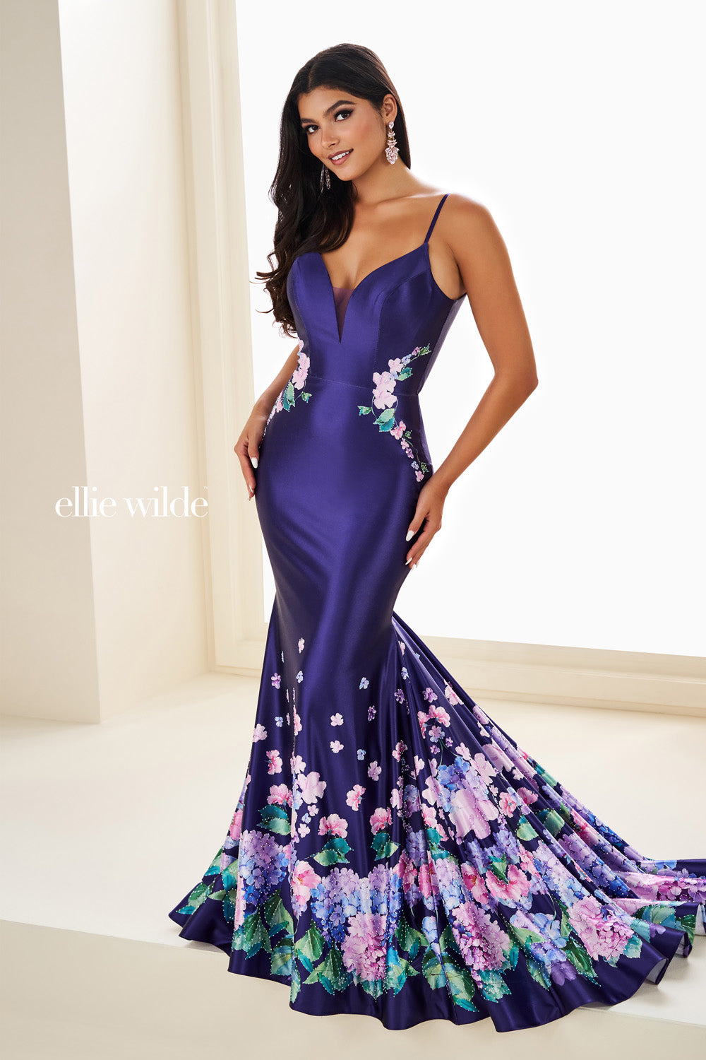 Ellie Wilde EW37000 purple mermaid dress with floral print and plunging neckline prom dress images.