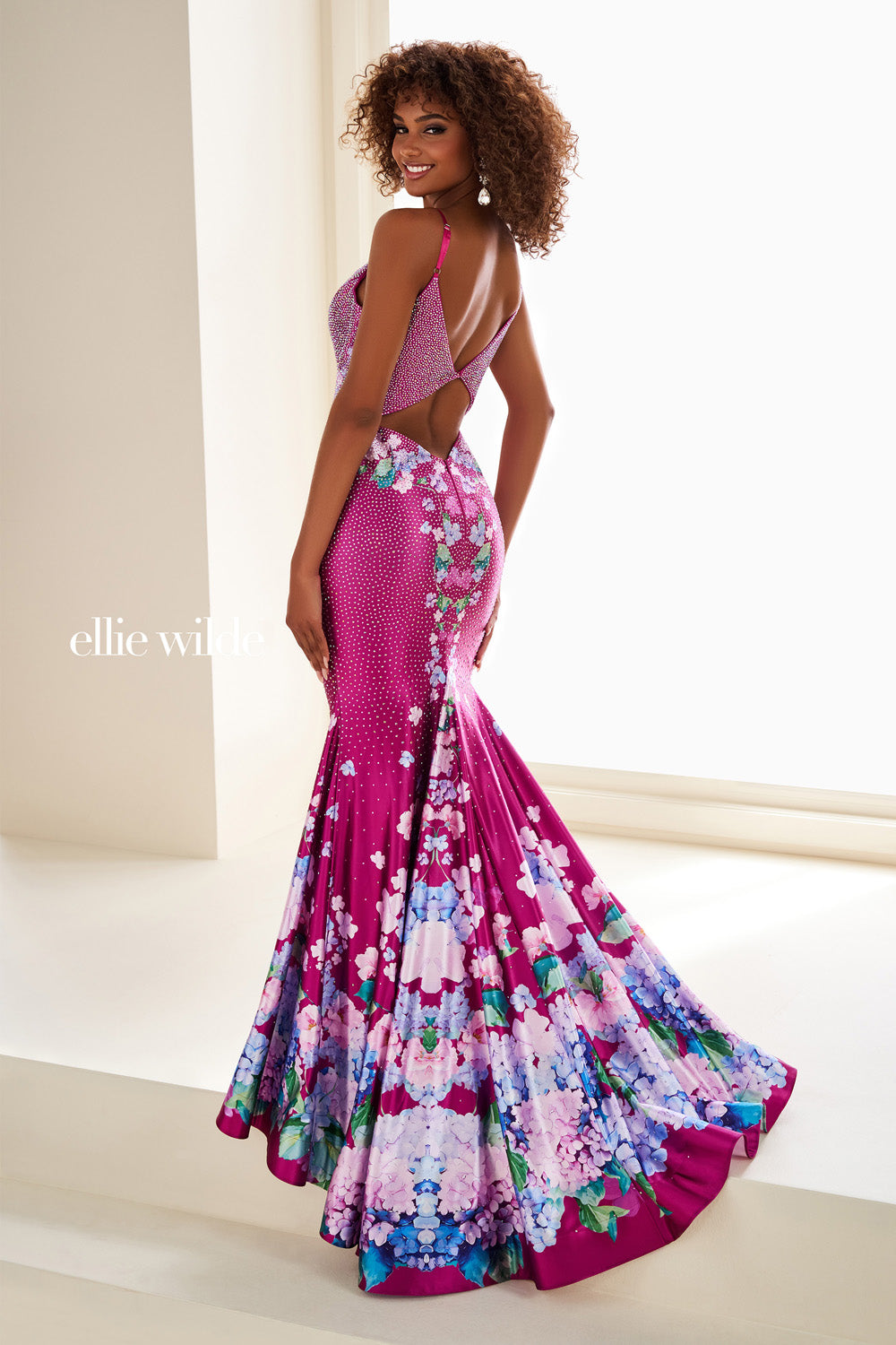 Ellie Wilde EW37005 fuchsia mermaid dress with floral print and open back prom dress images.