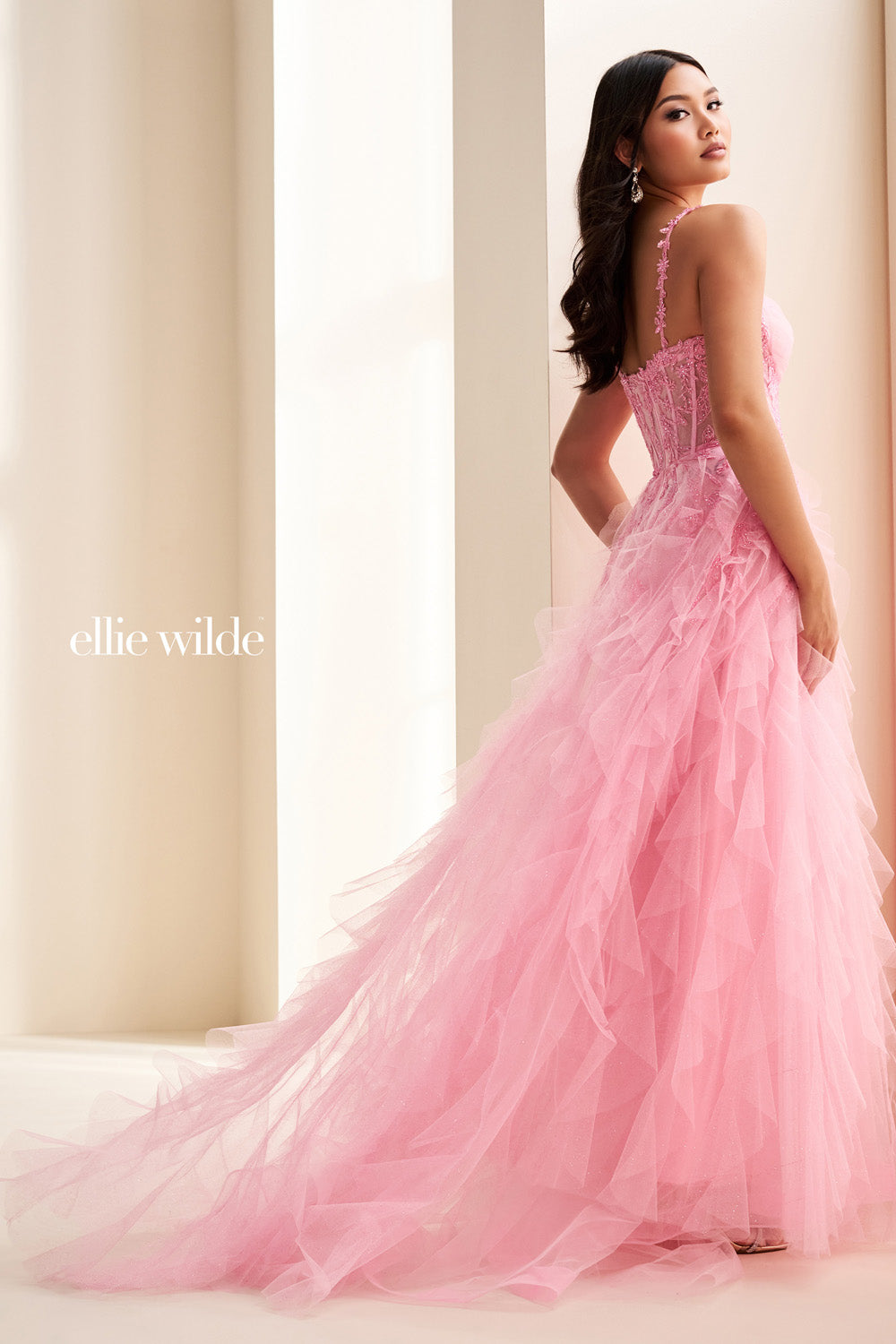 Ellie Wilde EW37031 pink, flowing silhouette with layered ruffles prom dress images.