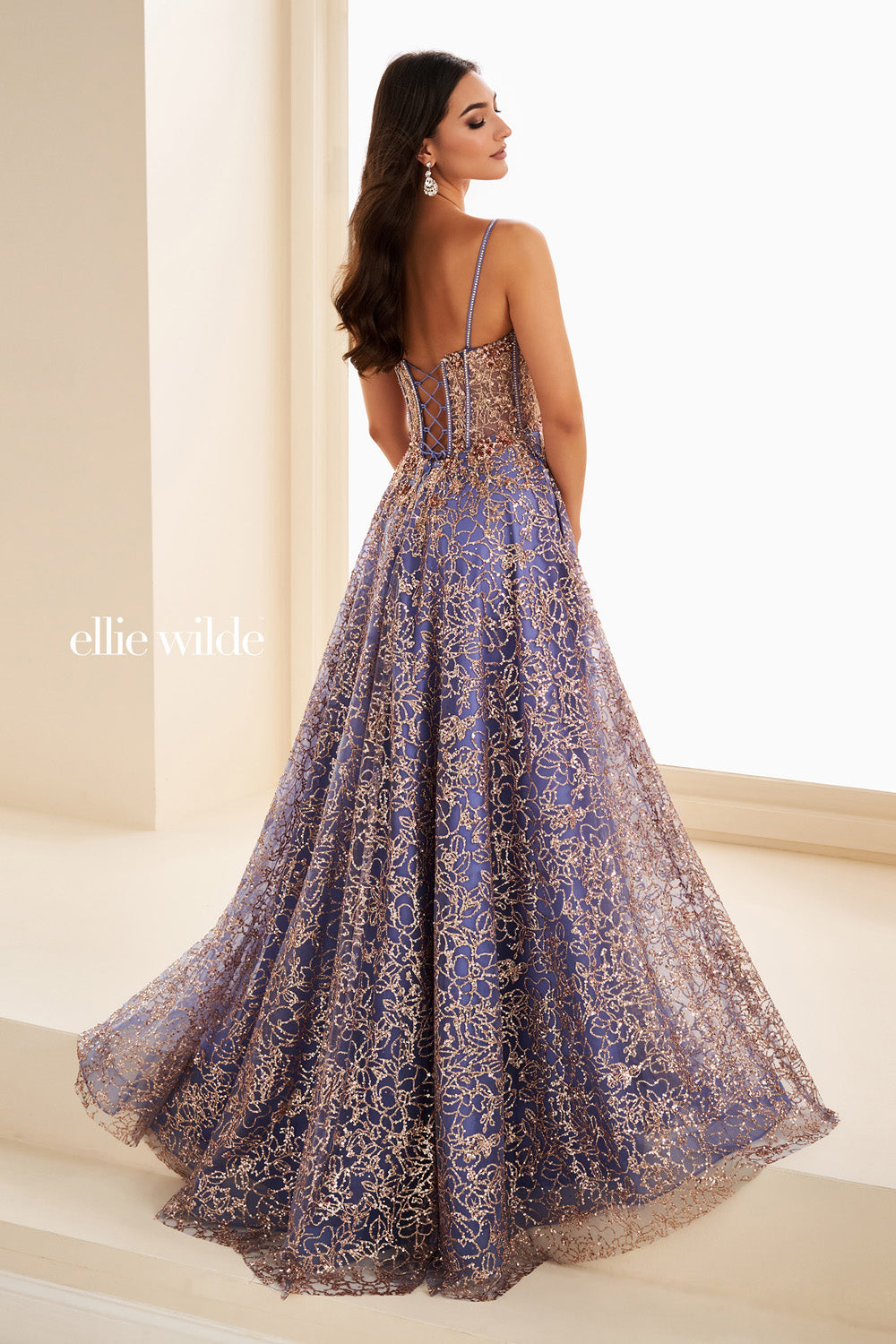 Ellie Wilde EW37205 lavender gown with intricate lace detailing and flowing skirt prom dress images.