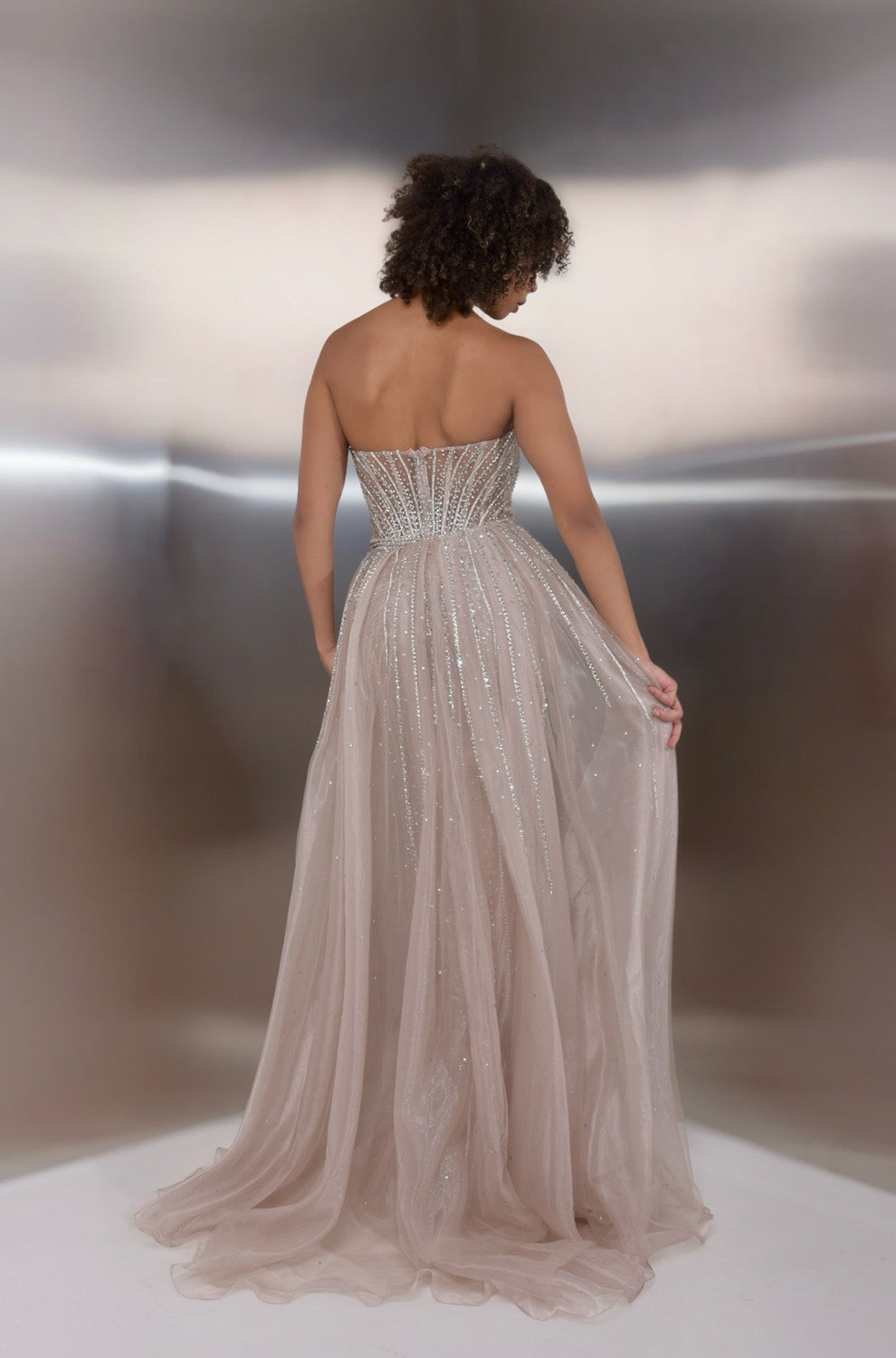 Jasz Couture 7932 Champagne formal gown with a fitted bodice and sparkling lace-up back, back view.