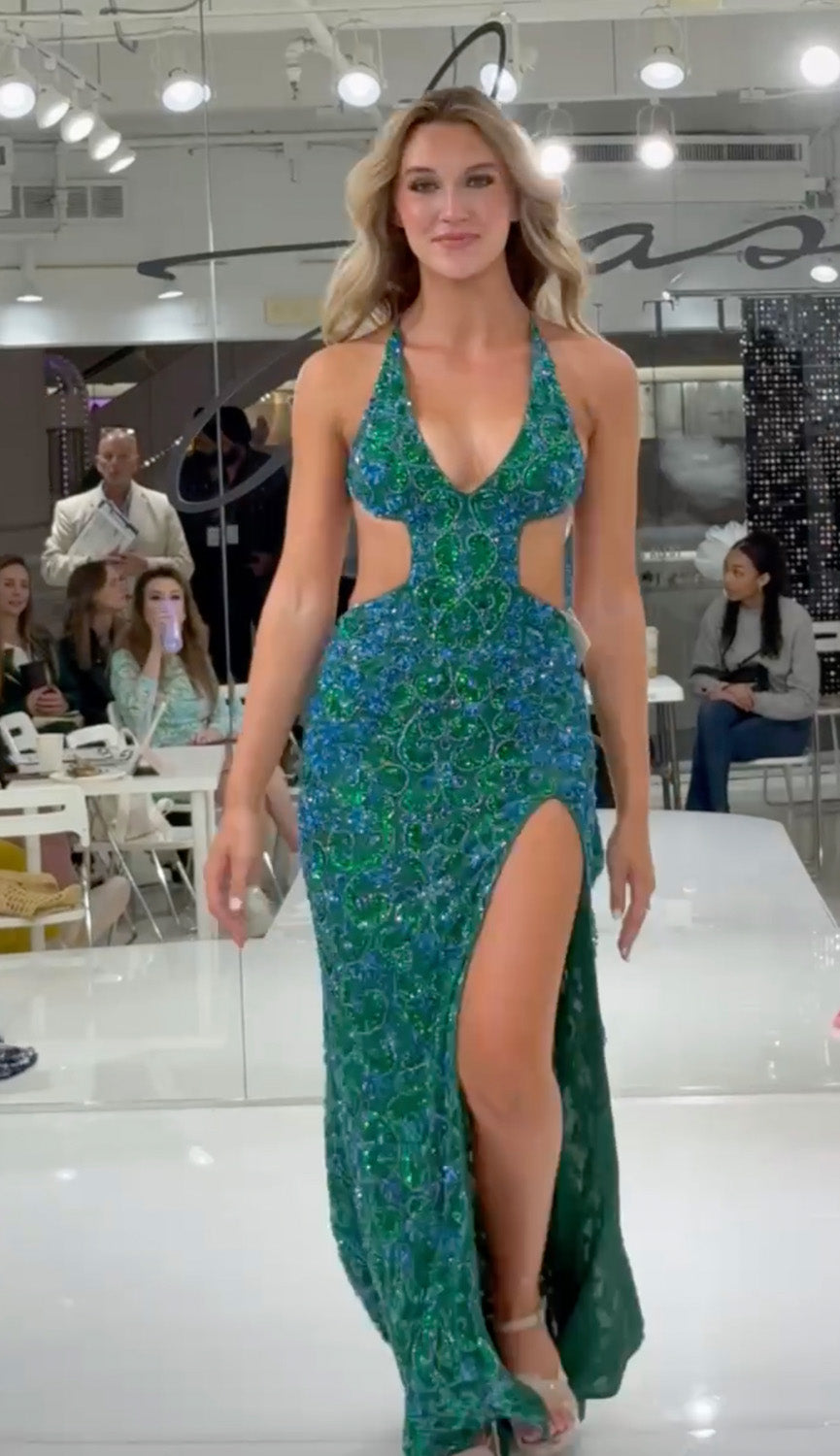 Jasz Couture 7936 Peacock prom dress with a fitted silhouette and high slit, showcasing intricate beading.