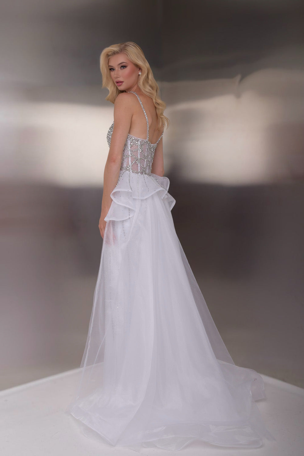 Jasz Couture 7946 White formal gown with lace detailing and a stunning layered back view.