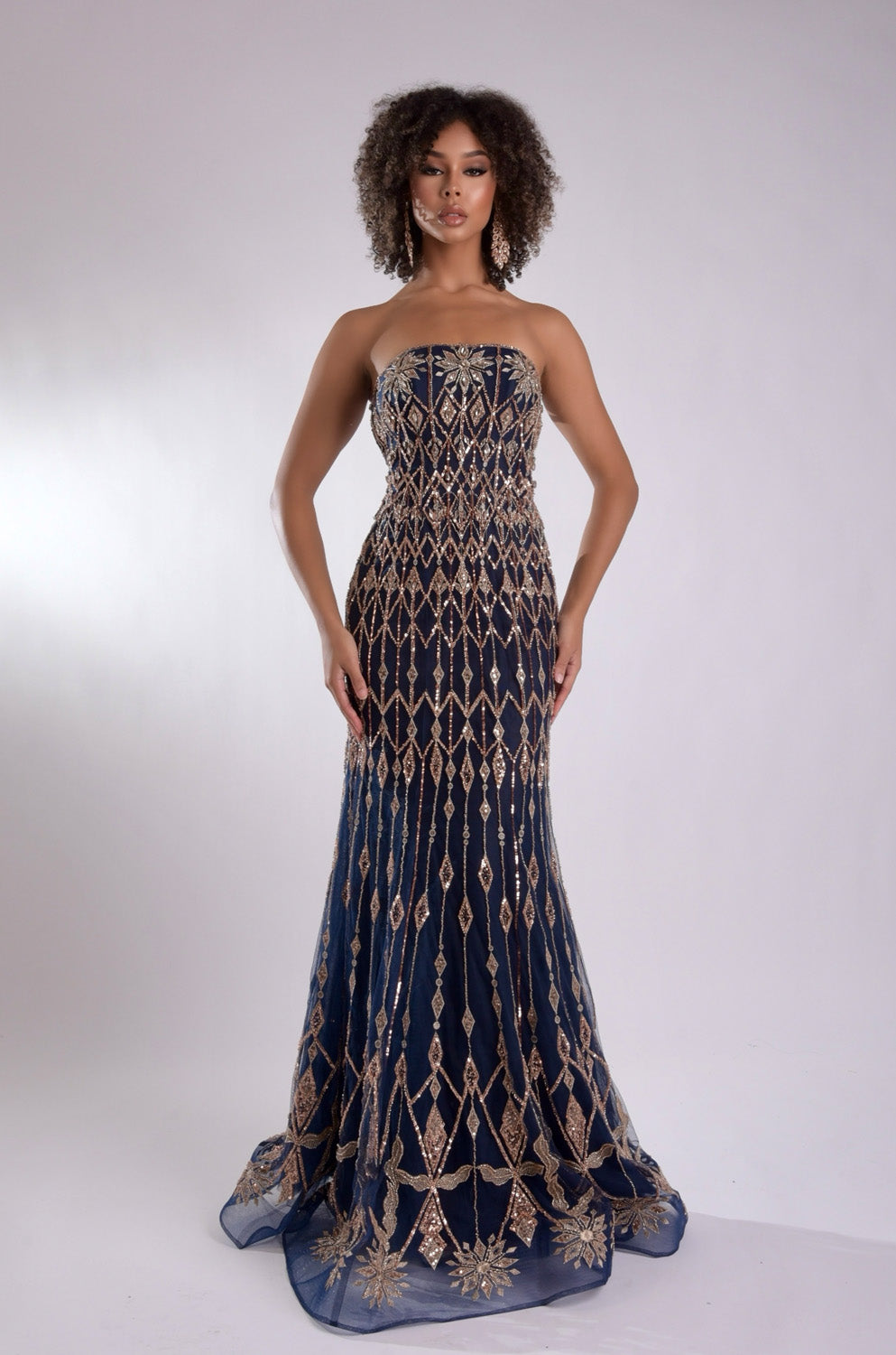 Jasz Couture 7947 Navy mermaid prom dress with intricate rose gold beading, front view.