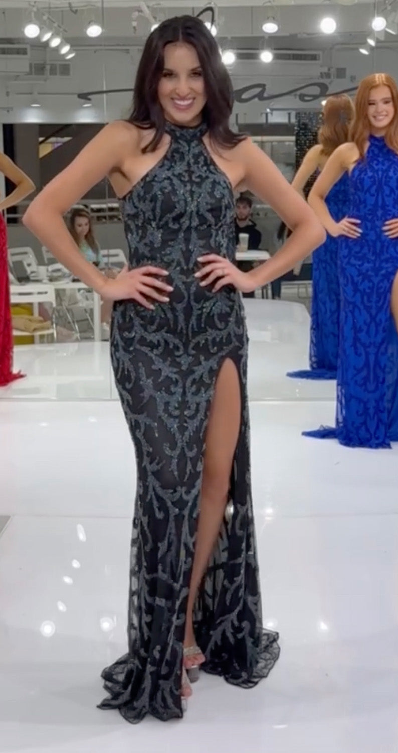 Jasz Couture 7956 Black gunmetal prom dress with a fitted silhouette and high slit, featuring intricate lace.