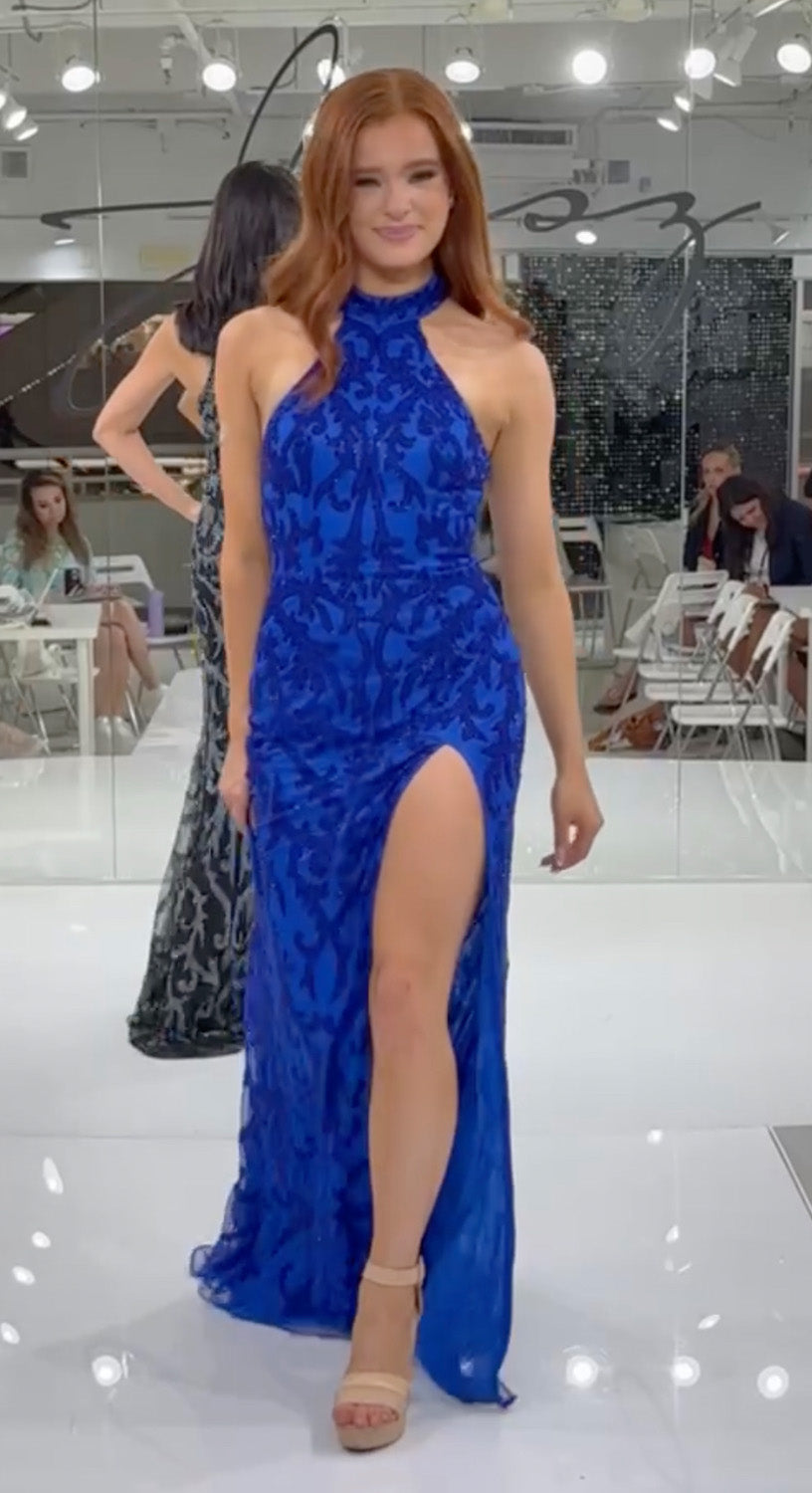 Jasz Couture 7956 Royal blue prom dress with a fitted silhouette and high slit.