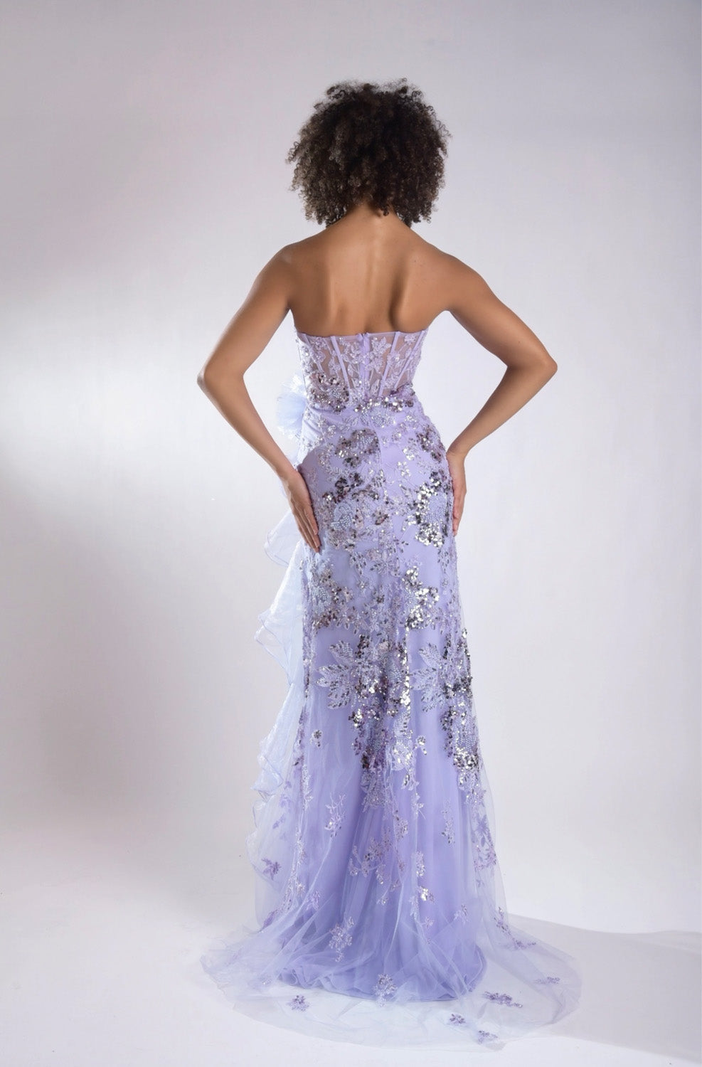 Jasz Couture 7960 Lilac mermaid prom dress with sequins and a lace-up back, back view.