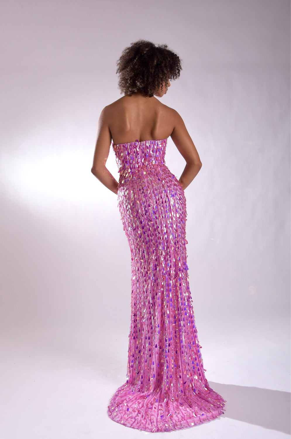 Jasz Couture 7973 Pink mermaid prom dress with sequins and a lace-up back, back view.
