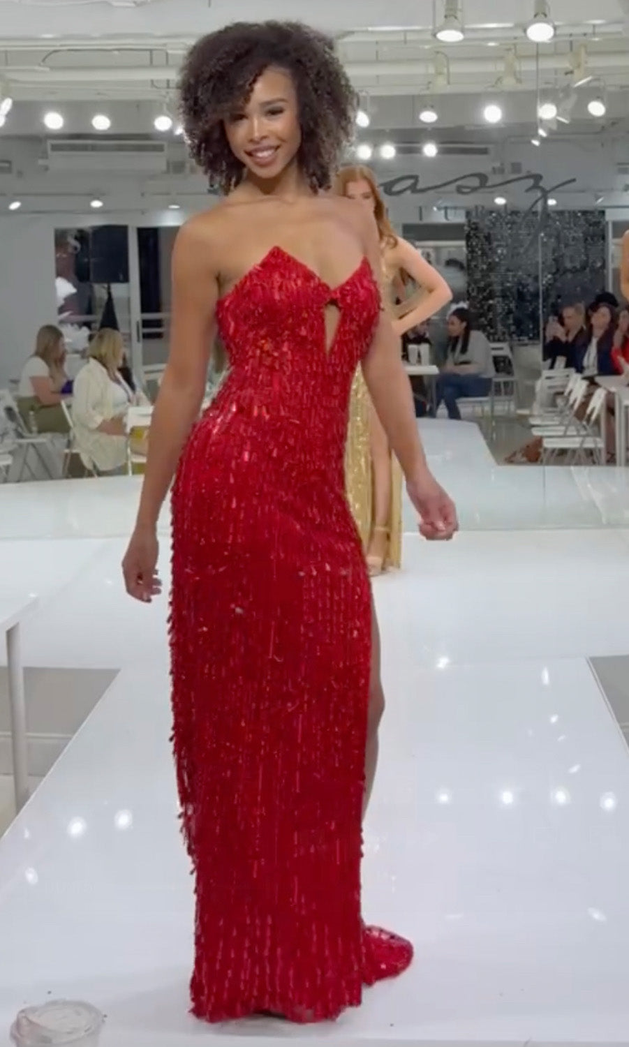 Jasz Couture 7973 Red fitted prom dress with fringe detail and a daring keyhole front view.