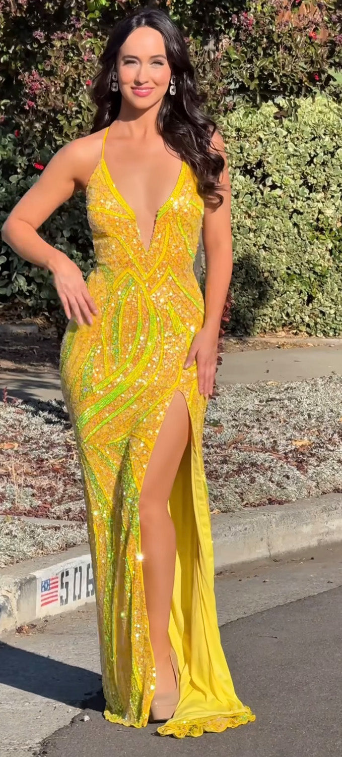 Jasz Couture 7977 Yellow fitted prom dress with a high slit and sparkling rhinestone details.