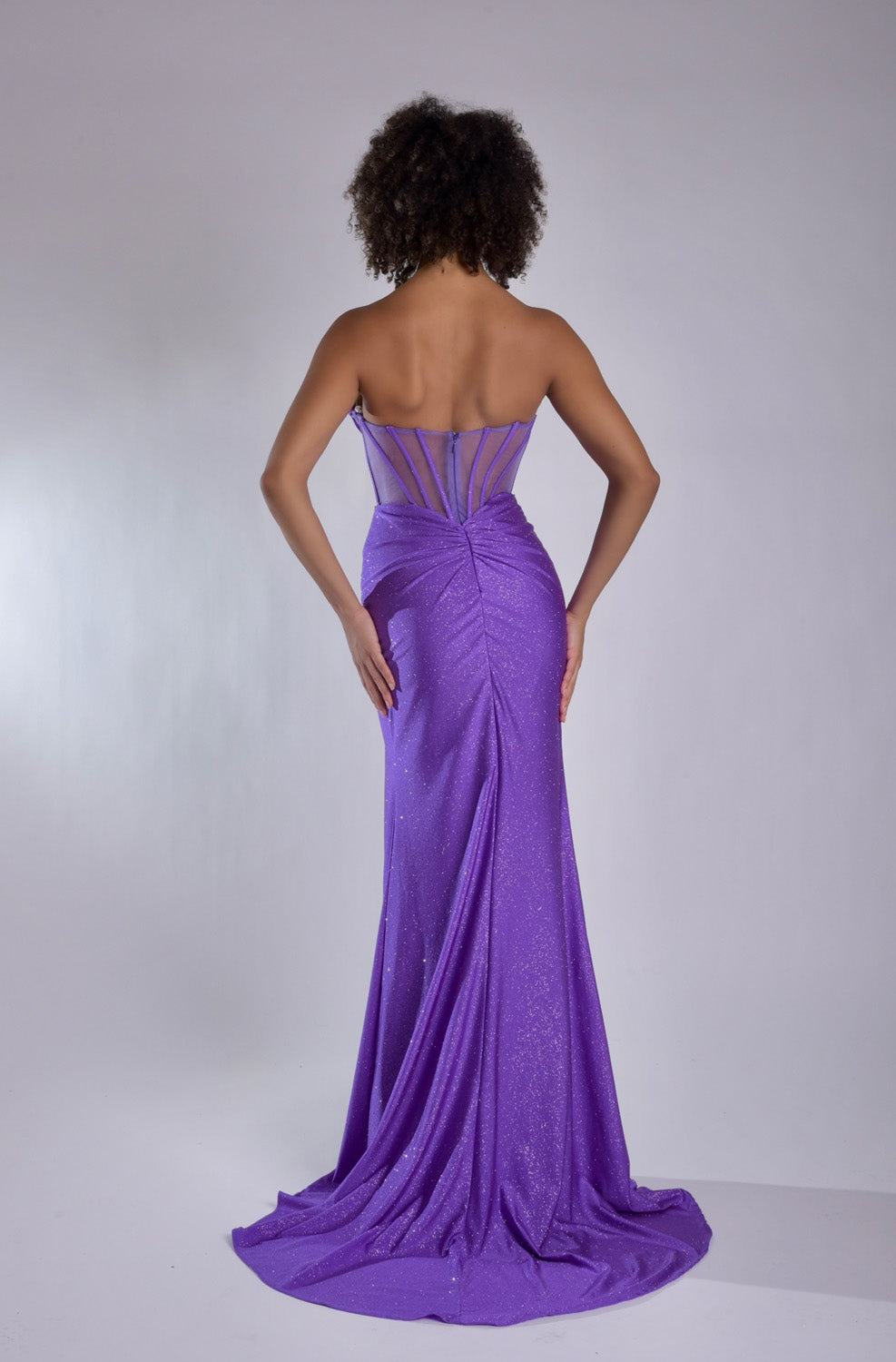 Jasz Couture 7978 Purple mermaid prom dress with lace-up back and elegant train, back view.