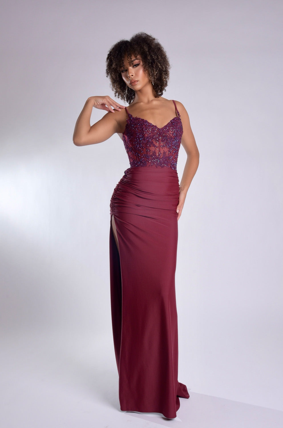 Jasz Couture 7988 Wine mermaid prom dress with lace bodice and side slit, front view.