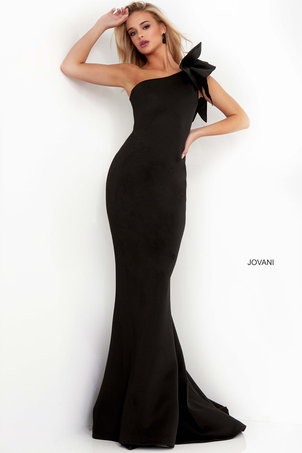 Jovani 32602 Black mermaid prom dress with a dramatic bow detail on the shoulder.