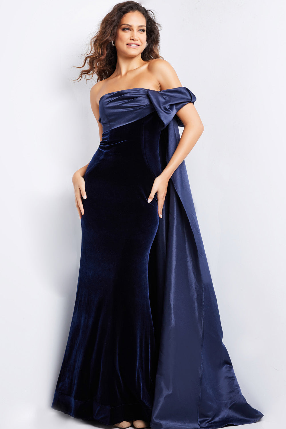 Jovani 37391 Navy mermaid prom dress with a dramatic off-shoulder design and flowing train.