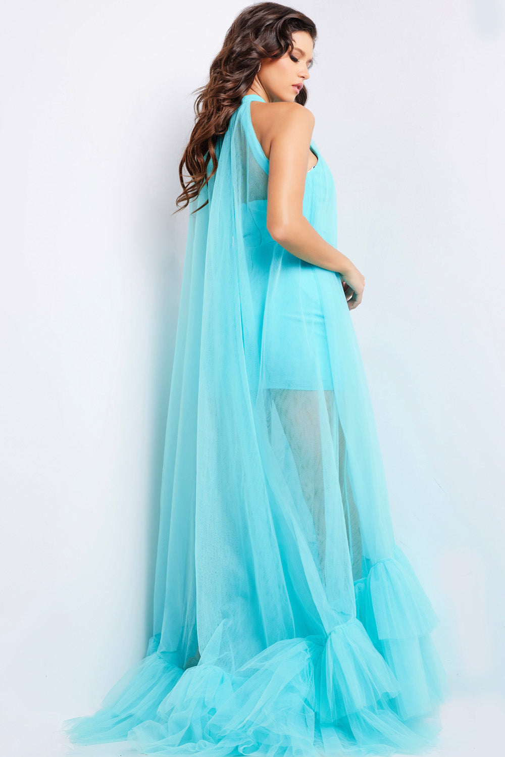 Jovani 38720 Turquoise prom dress with a fitted silhouette and dramatic tulle cape detail.