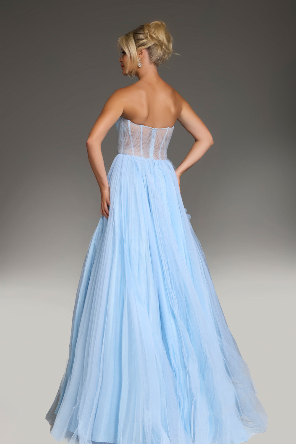 Jovani 38946 Pale blue A-line prom dress with a corset back and flowing tulle skirt.