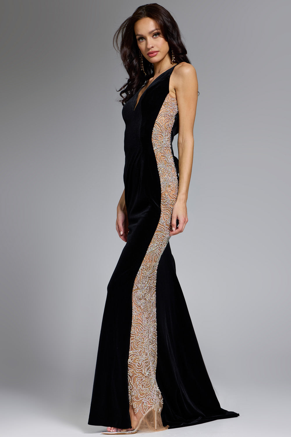 Jovani 42026 Black mermaid prom dress with intricate beading and a side slit, side view.