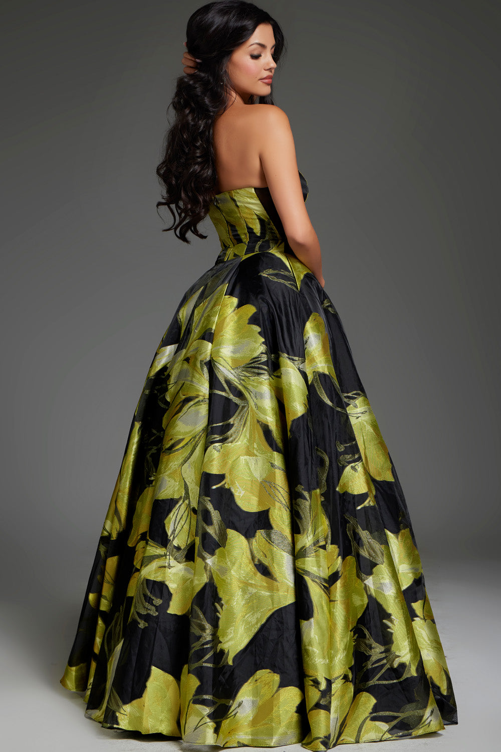 Jovani 42435 Yellow and black ballgown with floral print and a corset back, perfect for prom prom dress.