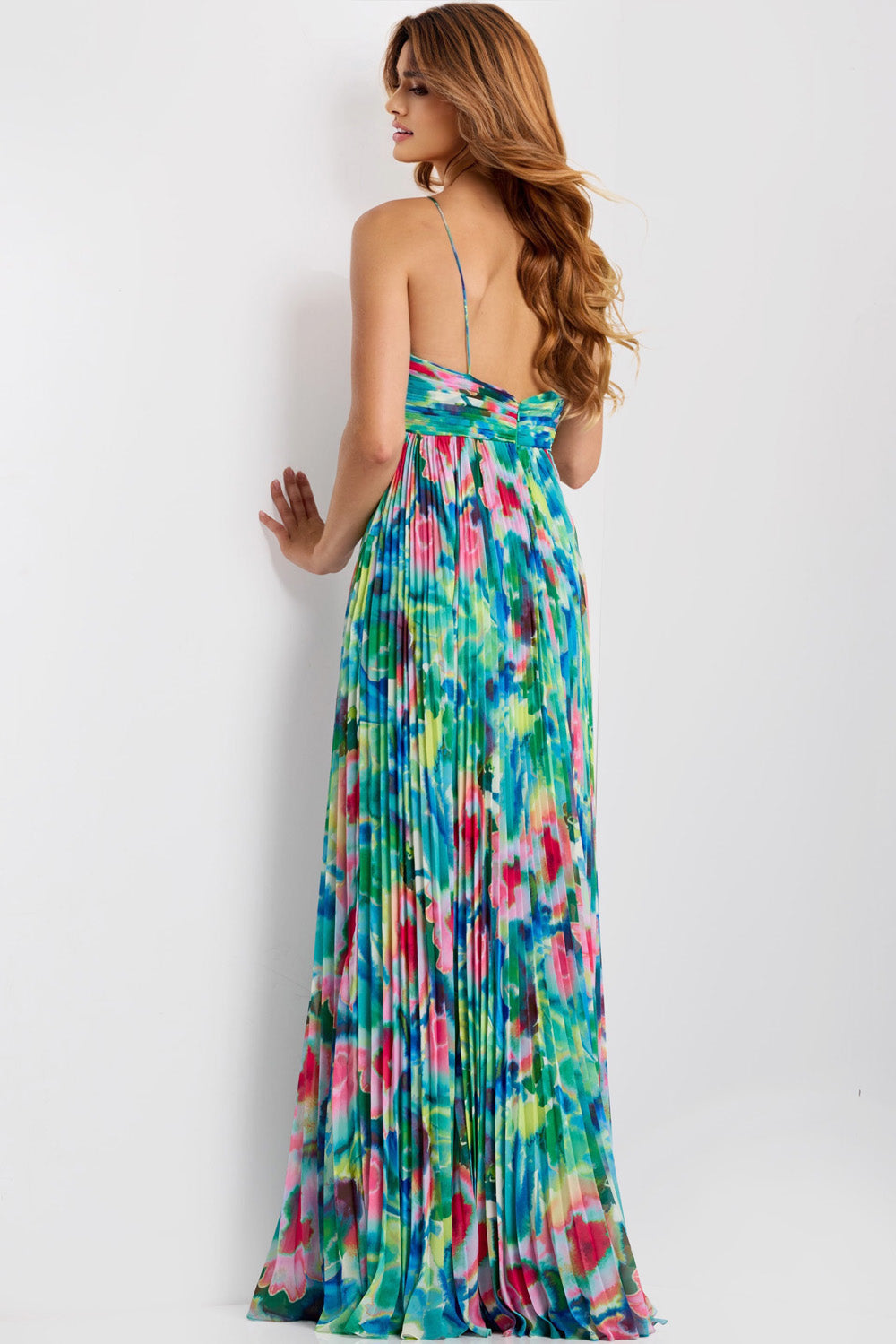 Jovani 42558 Colorful floral print formal gown with a pleated design and open back.