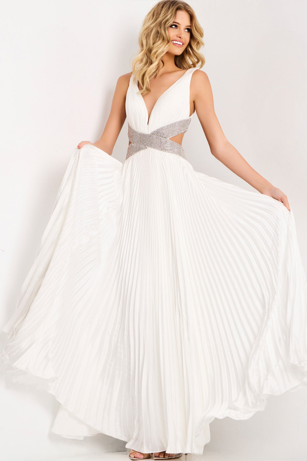 Jovani 42811 White pleated formal gown with a plunging neckline and beaded waist detail.