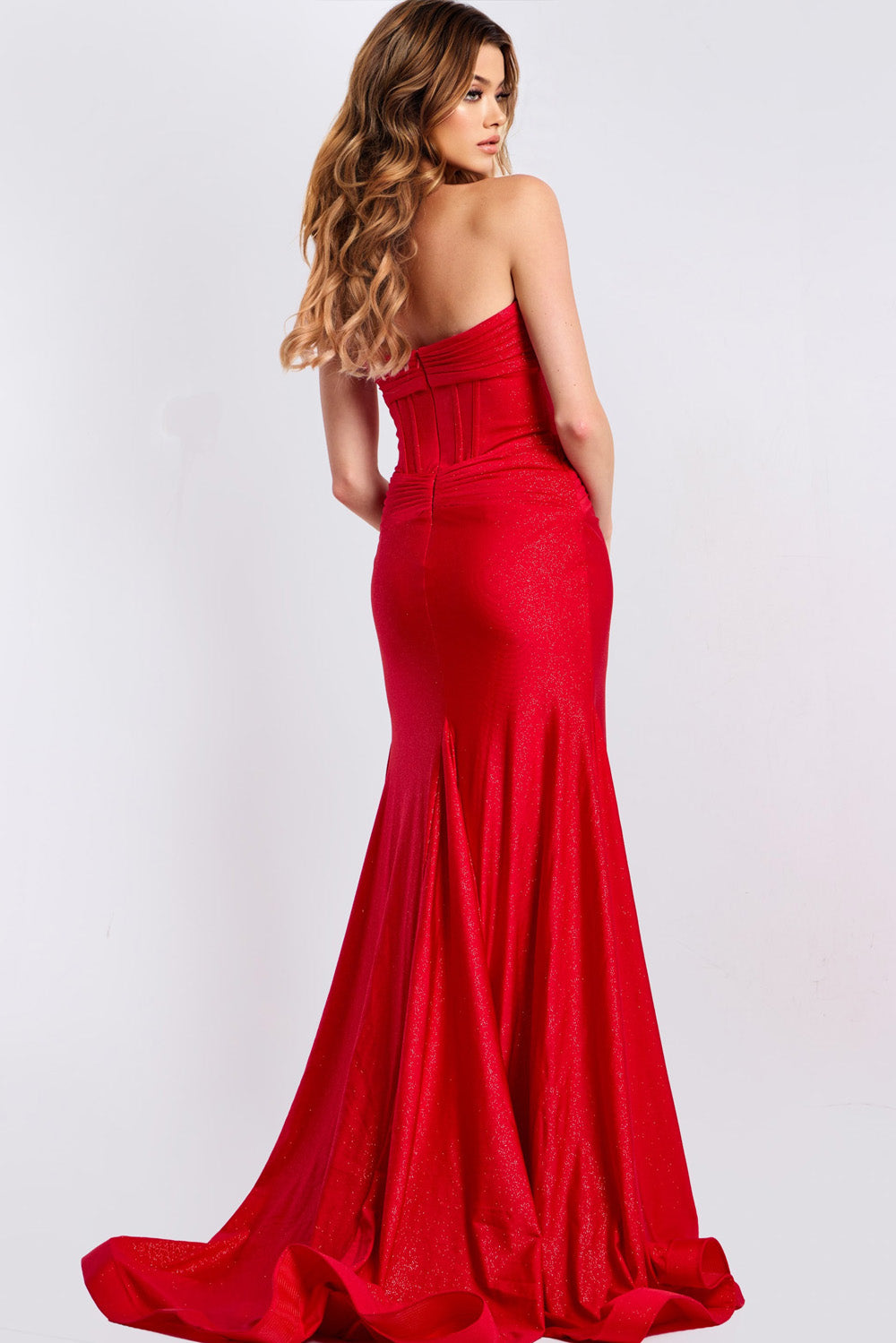 Jovani 43419 Red mermaid prom dress with a corset back and shimmering fabric, back view.