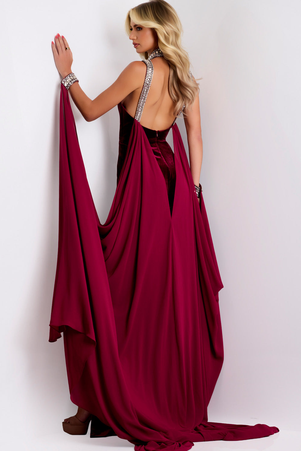 Jovani 43699 Burgundy formal gown with a fitted silhouette and elegant open back detail.