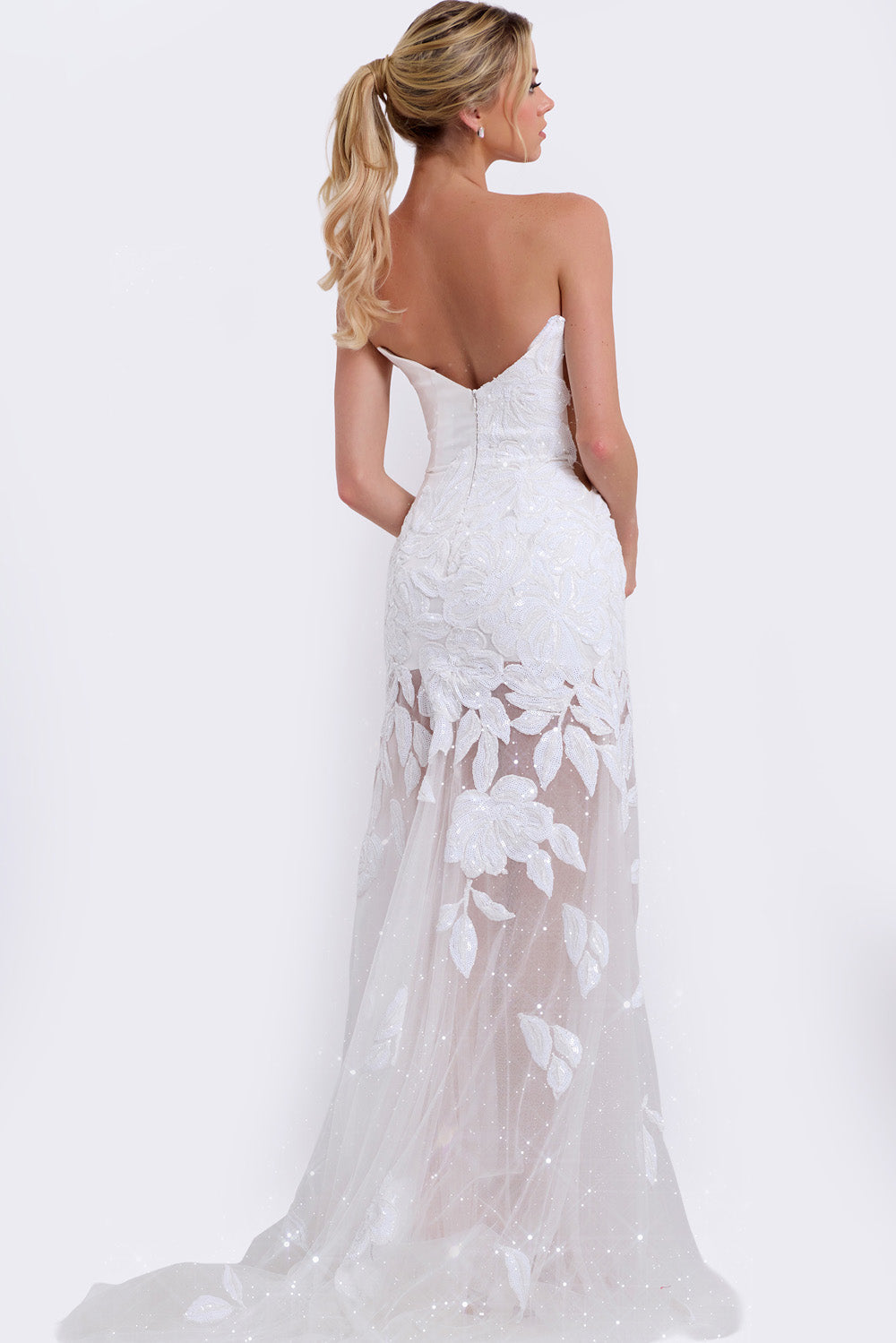 Jovani 44437 Off-white mermaid prom dress with floral lace and a low back, back view.