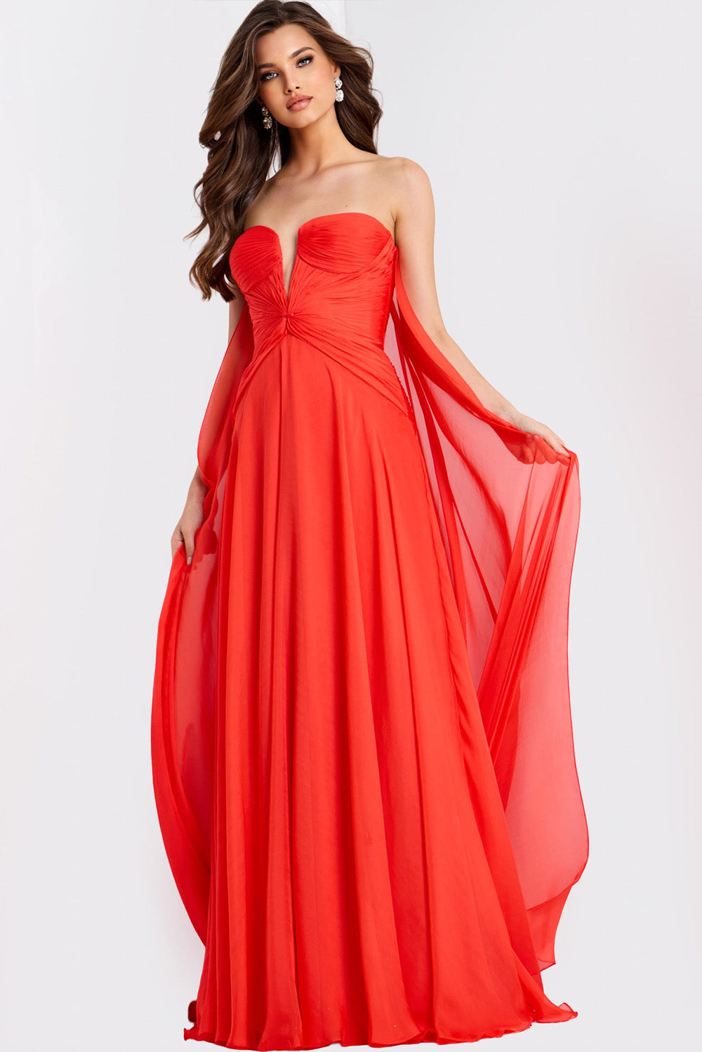 Jovani 45269 Strapless red prom dress with flowing cape and sweetheart neckline.