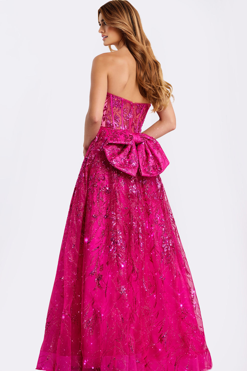 Jovani 45913 Raspberry formal gown with a fitted bodice and dramatic bow detail, back view.