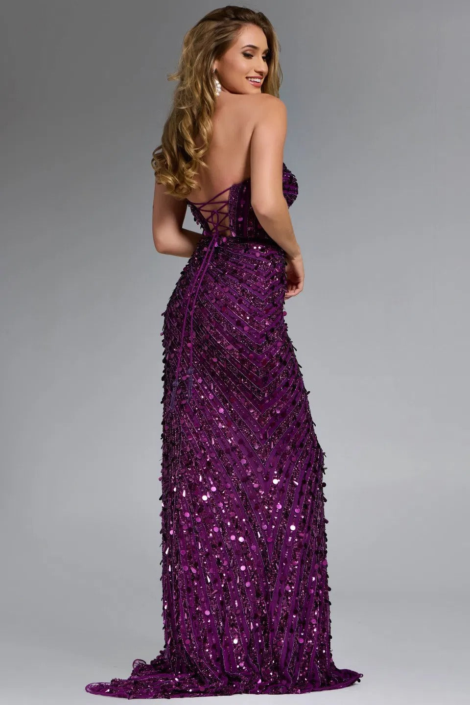 Jovani 46714 sequined mermaid plum prom dress with lace-up back, back view.