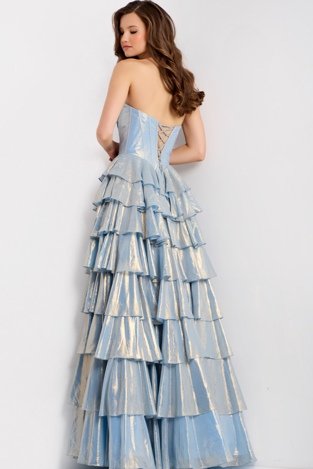 Jovani 47030 Light blue formal gown with tiered ruffles and lace-up back, back view.