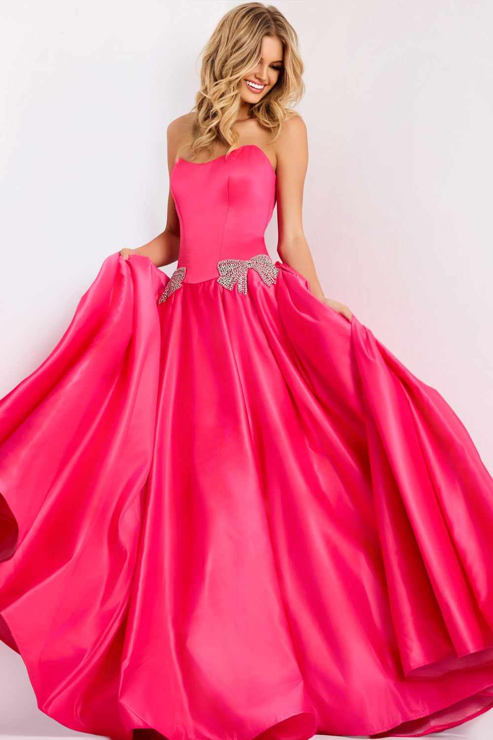 Jovani 47096 Fuchsia ballgown prom dress with beaded accents and a strapless neckline.