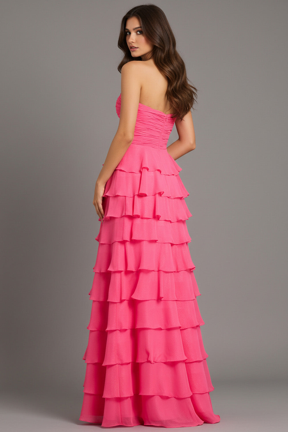 Jovani 47898 Pink tiered prom dress with a fitted bodice and ruffled skirt, back view.